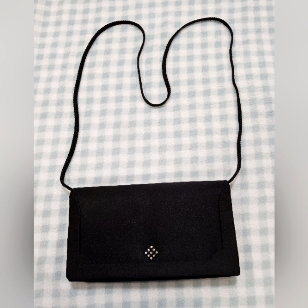 NYTLITES purse Black with rinestones on the front. Strap is 20" long from top